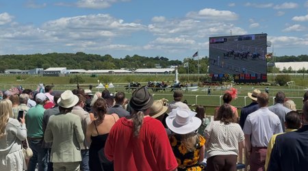 Fans watch a race on Preakness Stakes weekend at Laurel Park