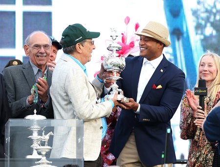 Owner Al Gold (left) receives the Woodlawn Vase from Maryland Gov. Wes Moore after Napoleon Solo won the Preakness Stakes at Laurel Park