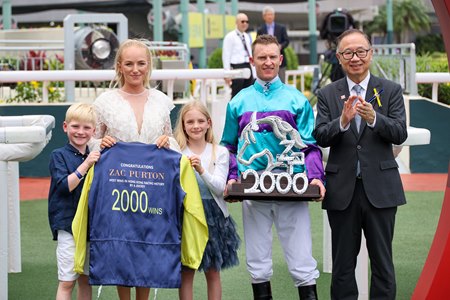 Zac Purton and his family with Hong Kong Jockey Club chairman Martin Liao after Purton won his 2,000th race in Hong Kong