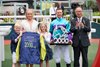 Zac Purton and his family with The Hon Martin Liao, Chairman, The Hong Kong Jockey Club, after the Australian rode a 2,000th winner in Hong Kong