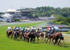 The runners in  the 7f Handicap head towards the stands
Goodwood 23.5.26 Pic: Edward Whitaker