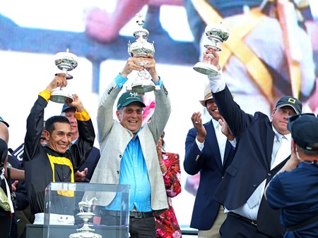Al Gold (center) holds up the Woodlawn Vase after Napoleon Solo won the Preakness Stakes at Oaurel Park