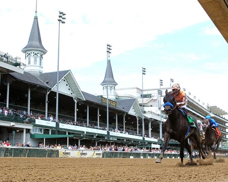 Splendora defeats Immersive (blue cap) in the Shawnee Stakes at Churchill Downs