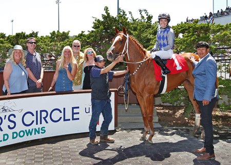 Jockey Talliyah Timentwa, aboard Made to Impact, celebrates her first Emerald Downs victory