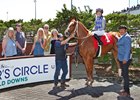 Jockey Talliyah Timentwa, aboard Made to Impact, celebrates her first Emerald Downs victory 