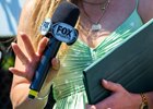 FOX Sports analyst and reporter Maggie Wolfendale closeup holding tools of the trade: mic, pen, and ipad. Being Betty with Irad Ortiz Jr. wins the Mount Vernon  in Saratoga Springs, N.Y., on June 3, 2026. 
