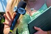 FOX Sports analyst and reporter Maggie Wolfendale closeup holding tools of the trade: mic, pen, and ipad. Being Betty with Irad Ortiz Jr. wins the Mount Vernon  in Saratoga Springs, N.Y., on June 3, 2026. 
