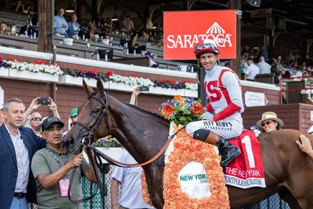 Portfolio Duration in the winner's circle after her victory the New York Stakes at Saratoga Race Course