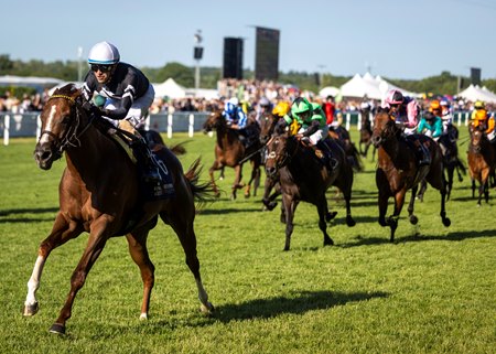 Bacio, wearing the silks of co-owner My Racehorse, draws off in the stretch to win a handicap at Ascot Racecourse
