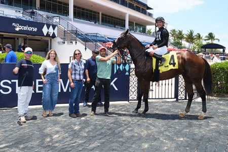 Mitts in the winner's circle after being placed first via disqualification in a maiden special weight race at Gulfstream Park