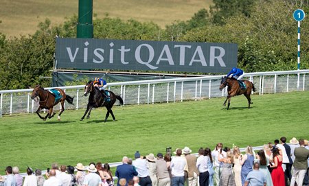 Scandinavia (striped cap) rolls to victory in the Goodwood Cup Stakes with the riderless Amiloc to his inside at Goodwood Racecourse