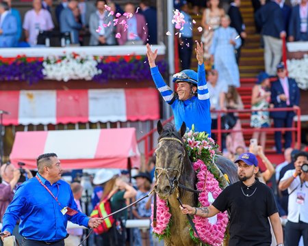 Junior Alvarado celebrates his win aboard Sovereignty in the Whitney Stakes at Saratoga Race Course