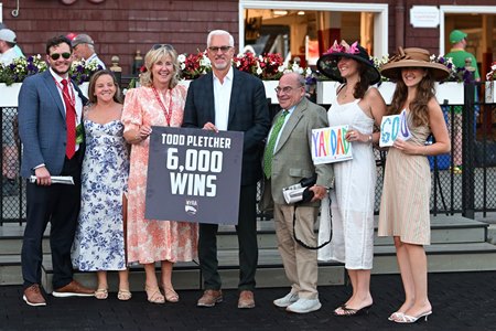 Todd Pletcher's 6,000th win is celebrated in the winner's circle at Saratoga Race Course