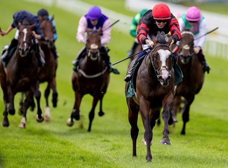 Folsom Blues pulls away to win the Vincent O'Brien National Stakes at the Curragh