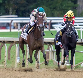 Summer Starlet (outside) kicks clear of Harper's Corner to win the Spinaway Stakes at Saratoga Race Course