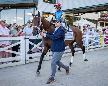 Leading Change leaves the paddock before winning the Travers Stakes at Saratoga Race Course