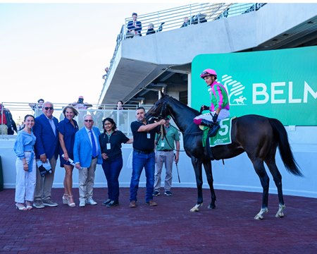 Lisa Joy in the winner's circle after her victory in the first race at the reopened Belmont Park