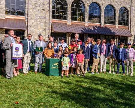 The connections of Thoroughbred Club of America Stakes winner Evanescence and others in the winner's circle at Keeneland