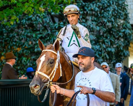 American History, under John Velazquez, enters the stakes winner's circle after the colt's victory in the Breeders' Futurity at Keeneland