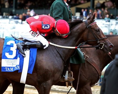 Jockey Junior Alvarado celebrates Tam Tam's victory in the Queen Elizabeth II Challenge Cup at Keeneland